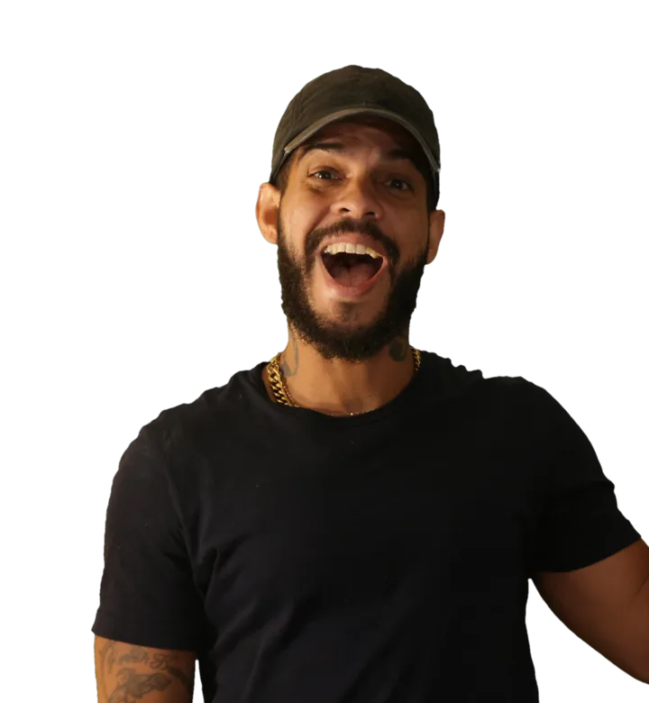 Frank Bibiloni, laughing, in a black tee and cap